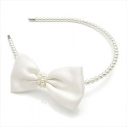 Cream and pearl bead look bow headband.