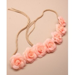 fabric roses on a plaited cord bandeaux. in pink/cream...