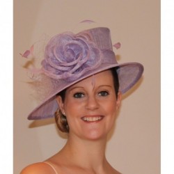 Sinamay Hat decorated with a flower, bow, feather and...