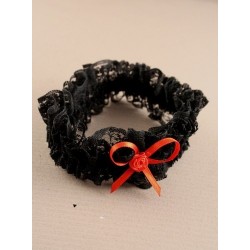 Brides black lace garter with red or black ribbon bow